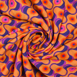 Viscose imprimée agitation violet et rose fond orange