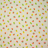 Jersey pointelle coton imprimé tutti frutti fond blanc cassé