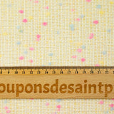 Tweed de laine mélangée confettis rose et bleu fond jaune