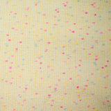 Tweed de laine mélangée confettis rose et bleu fond jaune