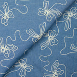 Chambray de coton brodé Lucie fond denim
