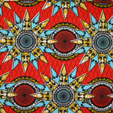 Coton imprimé ethnique Eindhoven bleu et ocre fond rouge
