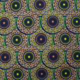Coton imprimé ethnique Haarlem orange et jaune fond vert
