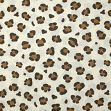 Coton imprimé léopard marron fond blanc cassé