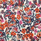 Jacquard de coton natté ikat fleuris orange et bleu fond blanc cassé