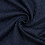 Jersey matelassé tresses fond bleu marine