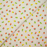 Jersey pointelle coton imprimé tutti frutti fond blanc cassé