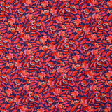 Mousseline imprimée fleurs rouge fond bleu roi
