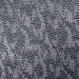 Mousseline plumetis impression argent parsemé fond marine