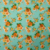 Popeline de coton imprimée bouquet orange fond vert d'eau