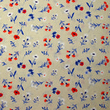 Popeline de coton imprimée envol de fleurs bleu, blanc, rouge fond grège