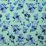 Popeline de coton imprimée fleur bleu roi fond vert jade