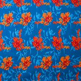 Popeline de coton imprimée fleur stylisée orange fond turquoise