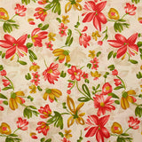 Popeline de coton imprimée fleurs ocre et rouge fond beige