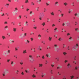 Popeline de coton imprimée fleurs printanières fond rose barbie