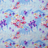 Popeline de coton imprimée l'ombre des fougères fond bleu layette