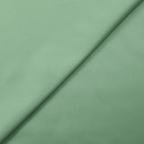 Popeline de coton satinée vert amande