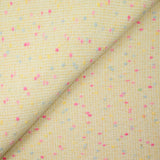 Tweed de laine mélangée confettis rose et bleu fond jaune