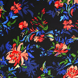 Viscose imprimée bataille de fleurs fond noir