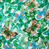Viscose imprimée jacquard papillons bleus et verts fond blanc