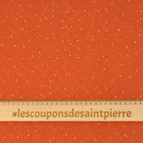Double gaze matelassé orange confettis doré vendu au mètre
